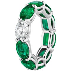 Oval Shaped Emerald and Diamond Horizontally East West Eternity Band Ring