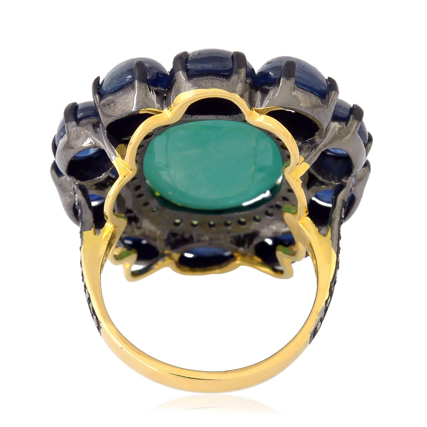 Oval Shaped Emerald Cocktail Ring Accented With Blue Sapphire & Diamonds In New Condition For Sale In New York, NY