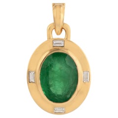 Oval Shaped Emerald Pendant With Diamonds Enclosed In 18k Yellow Gold Frame