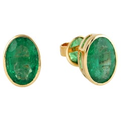 Oval Shaped Emerald Studs Made In 18k Yellow Gold