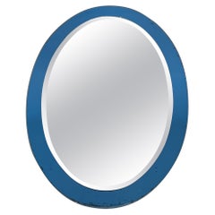 Oval-Shaped Mirror with a Bluish Surround by Crystal Art Torino. Circa 1960