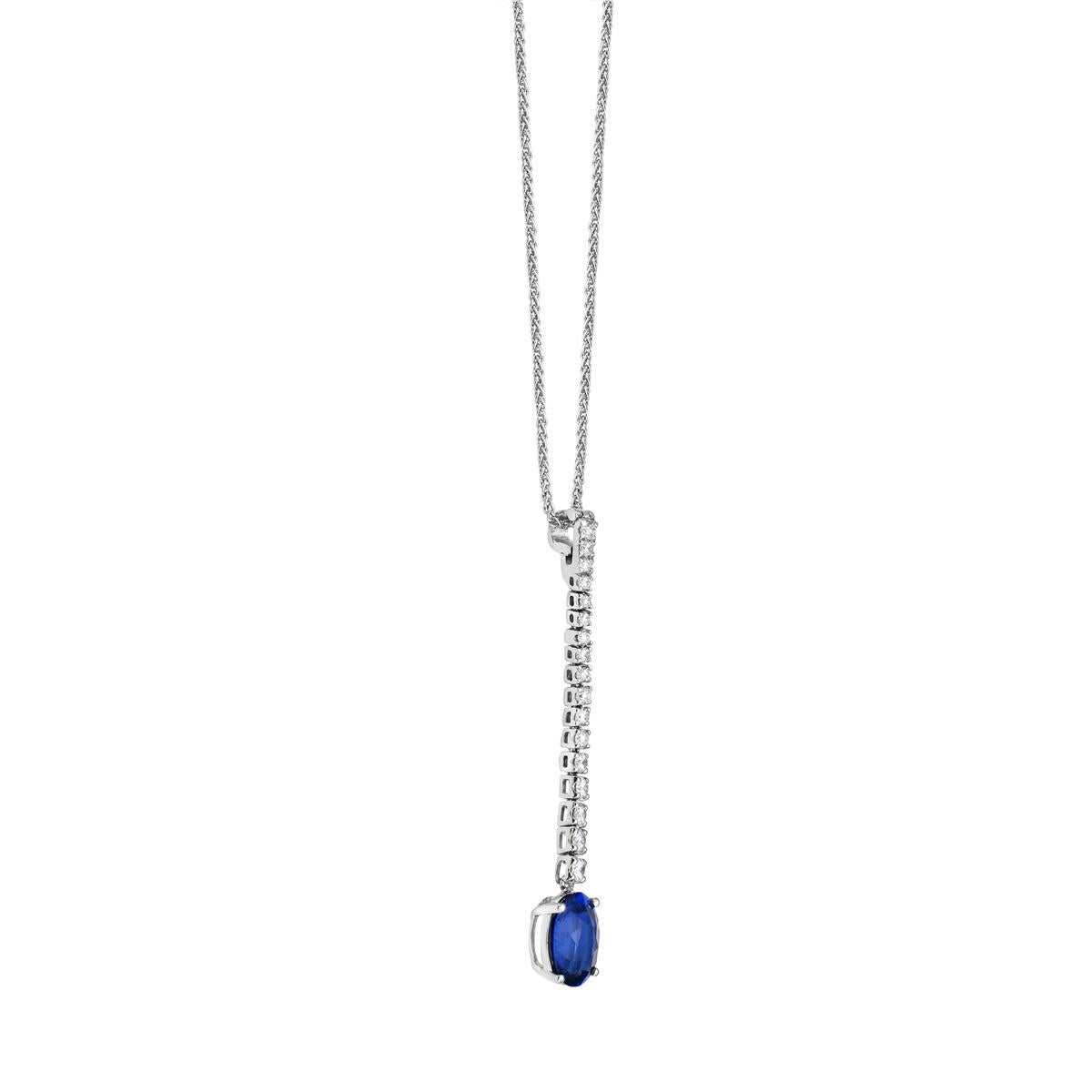 With this diamond and sapphire oval-shaped necklace, style and glamour are in the spotlight. This 18-karat diamond and sapphire oval-shaped necklace is made from 2.1 grams of gold. This necklace is adorned with VS2, G color diamonds, made out of 17