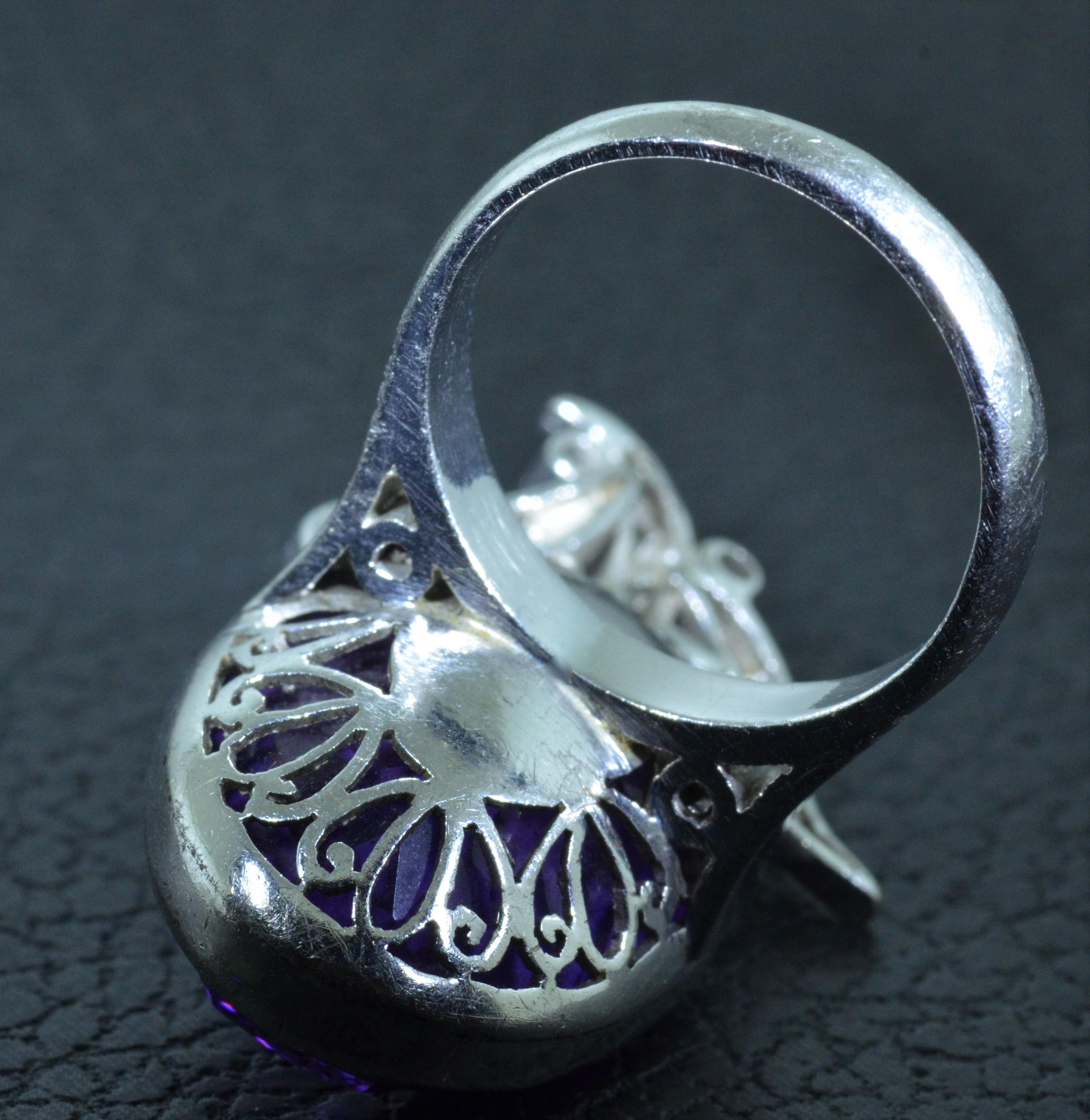 Oval shaped Siberian Amethyst Cocktail Ring in 14 karat white gold.  The ring is set with an oval shaped deep vivid Purple Amethyst and also set with Diamonds. 


Special Note: The Amethyst has an 