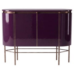 Meuble ovale à deux portes, en laque « Aubergine Noir » et métal patiné bronze