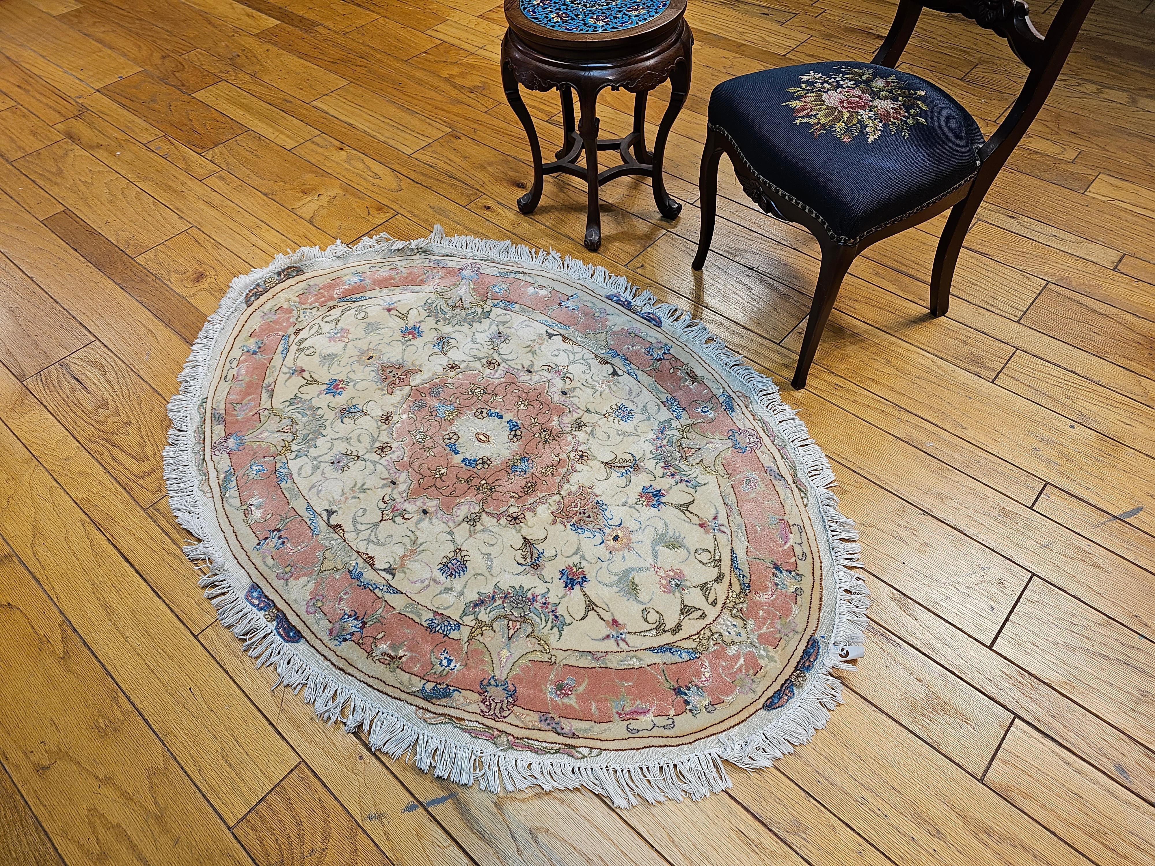 Hand-Knotted Oval Shaped Vintage Persian Tabriz in Floral Pattern in Ivory, Pale Pink, Blue For Sale