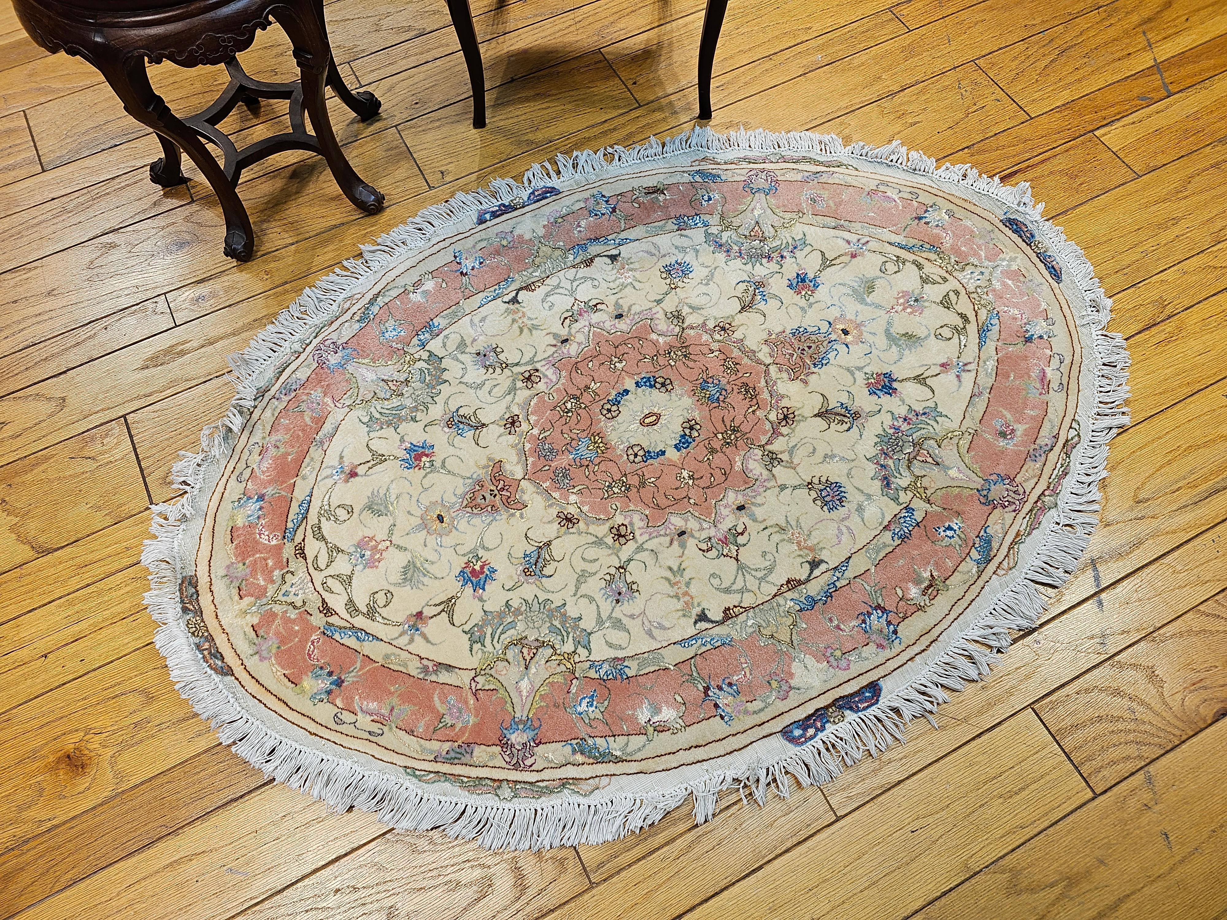 Oval Shaped Vintage Persian Tabriz in Floral Pattern in Ivory, Pale Pink, Blue In Good Condition For Sale In Barrington, IL