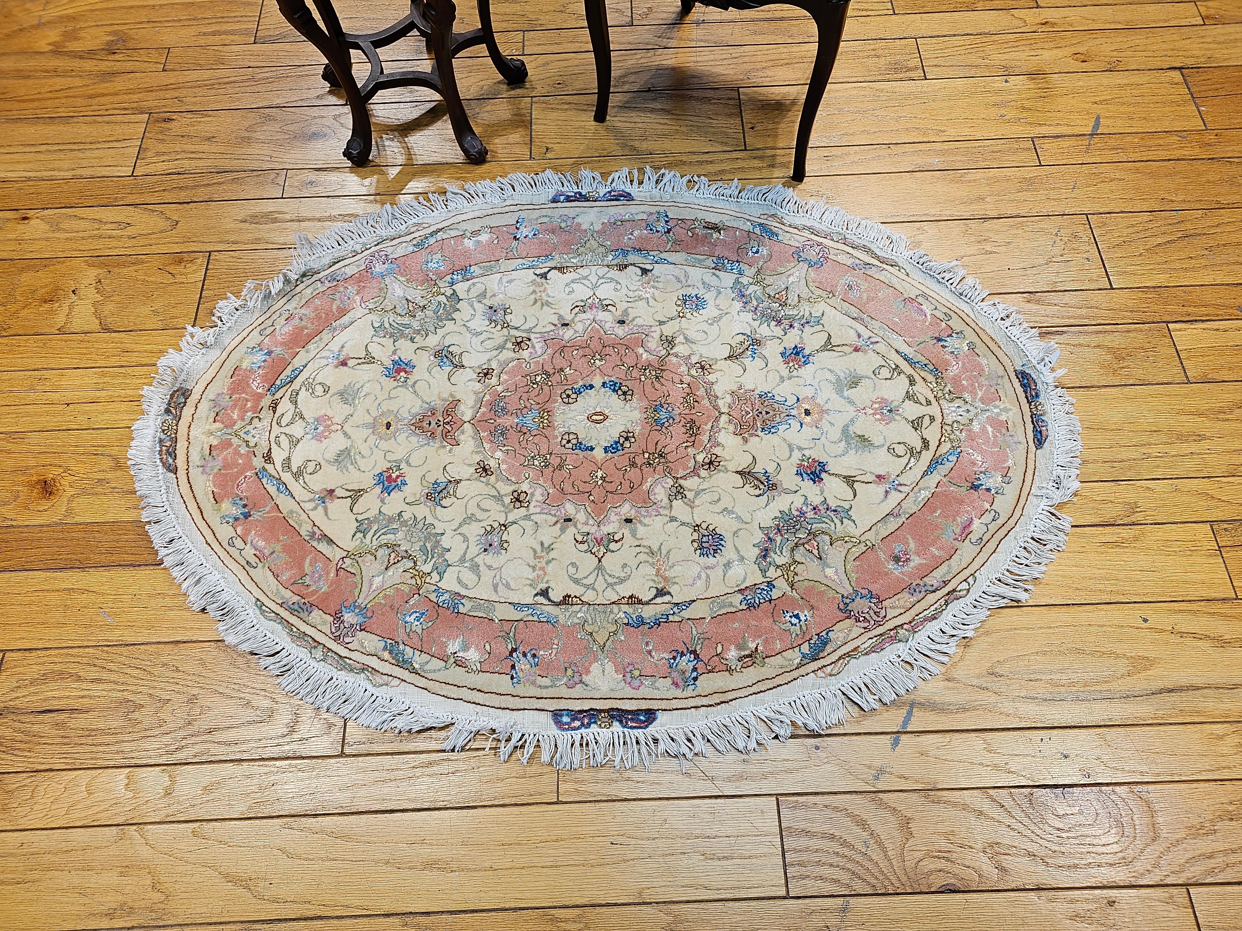 20th Century Oval Shaped Vintage Persian Tabriz in Floral Pattern in Ivory, Pale Pink, Blue For Sale