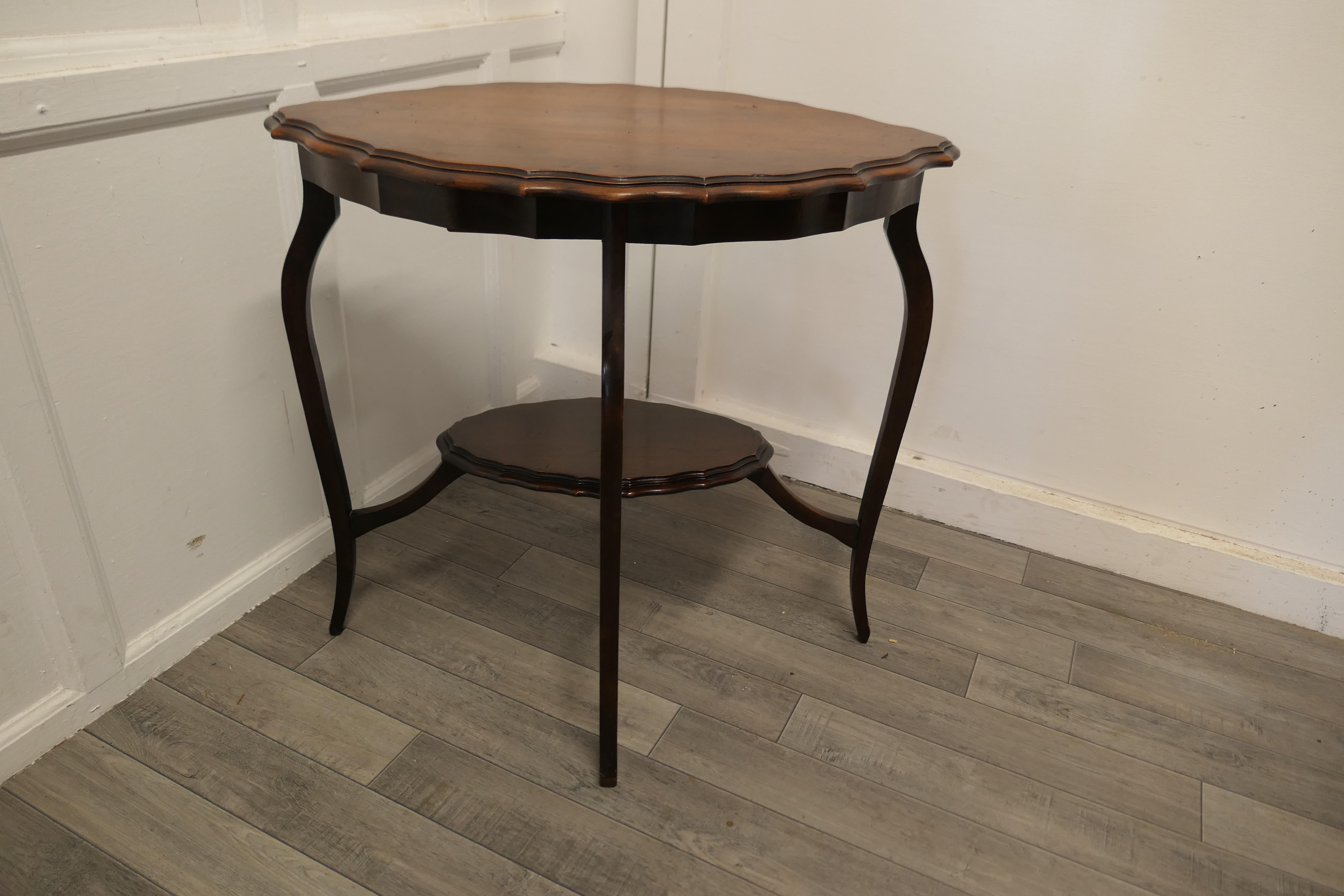 Early 20th Century Oval Shaped Walnut Occasional Table, with Undertier For Sale