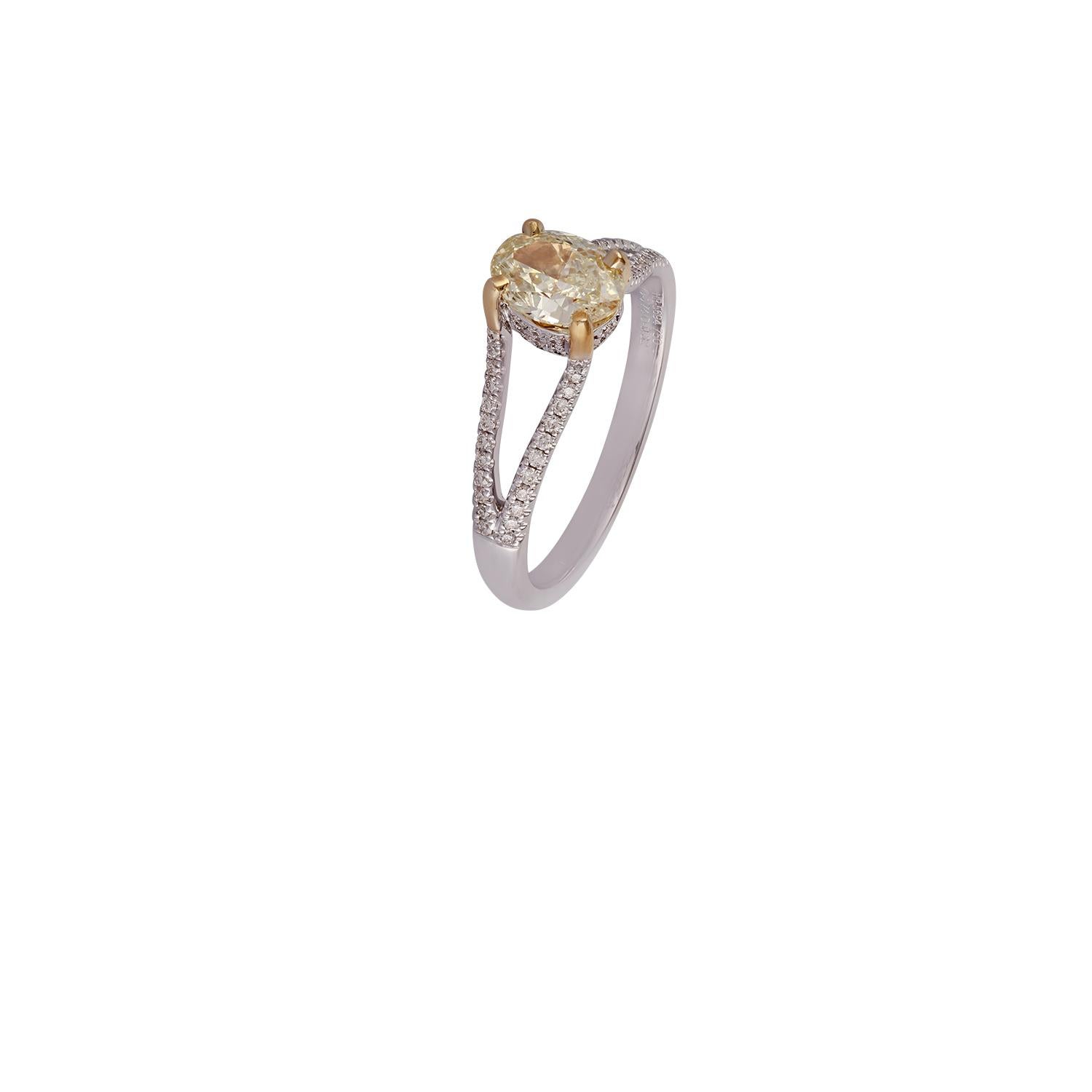 Contemporary Oval Shaped Yellow Diamond Ring Studded in 18 Karat White Gold For Sale