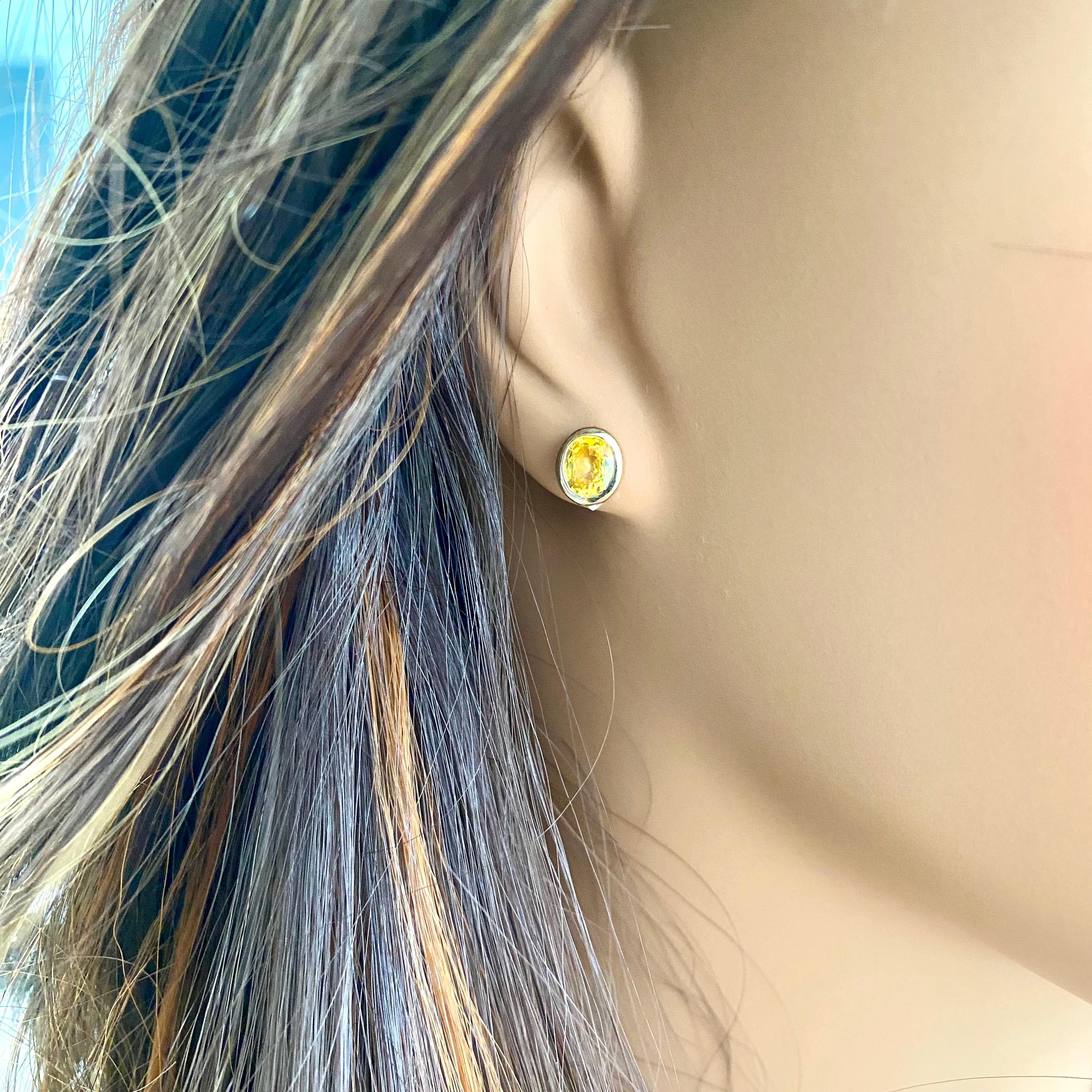 Contemporary Yellow Sapphire 1.95 Carat Bezel Set 14 Karat Yellow Gold 0.35 Inch Earrings For Sale