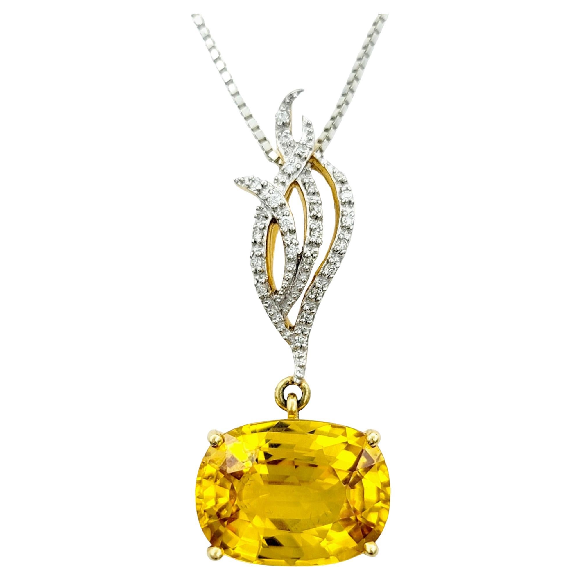 This elegant yellow sapphire pendant exudes timeless charm, combining the rich allure of the gemstone with the brilliance of the natural white diamonds set in 18 karat yellow gold.

The horizontally set gemstone, a captivating yellow oval sapphire,