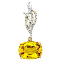 Pendentif en or jaune 18 carats, saphir jaune de forme ovale et diamant rond serti