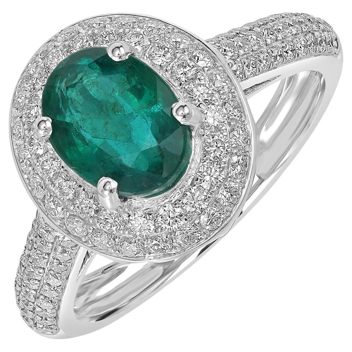 Bague en or blanc 18k avec émeraude zambienne de forme ovale et diamants pavés