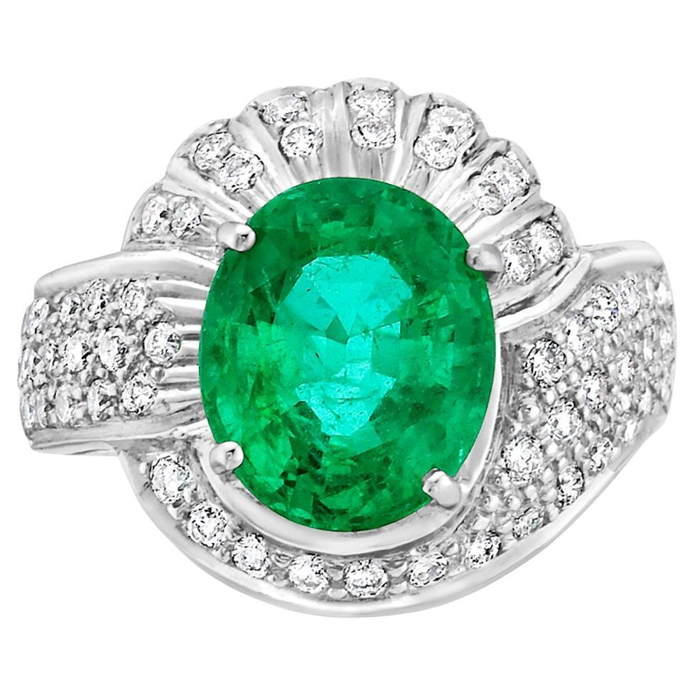 Oval Shaped Zambian Emerald Cocktail Ring with Pave VS Diamond In 18k White Gold For Sale