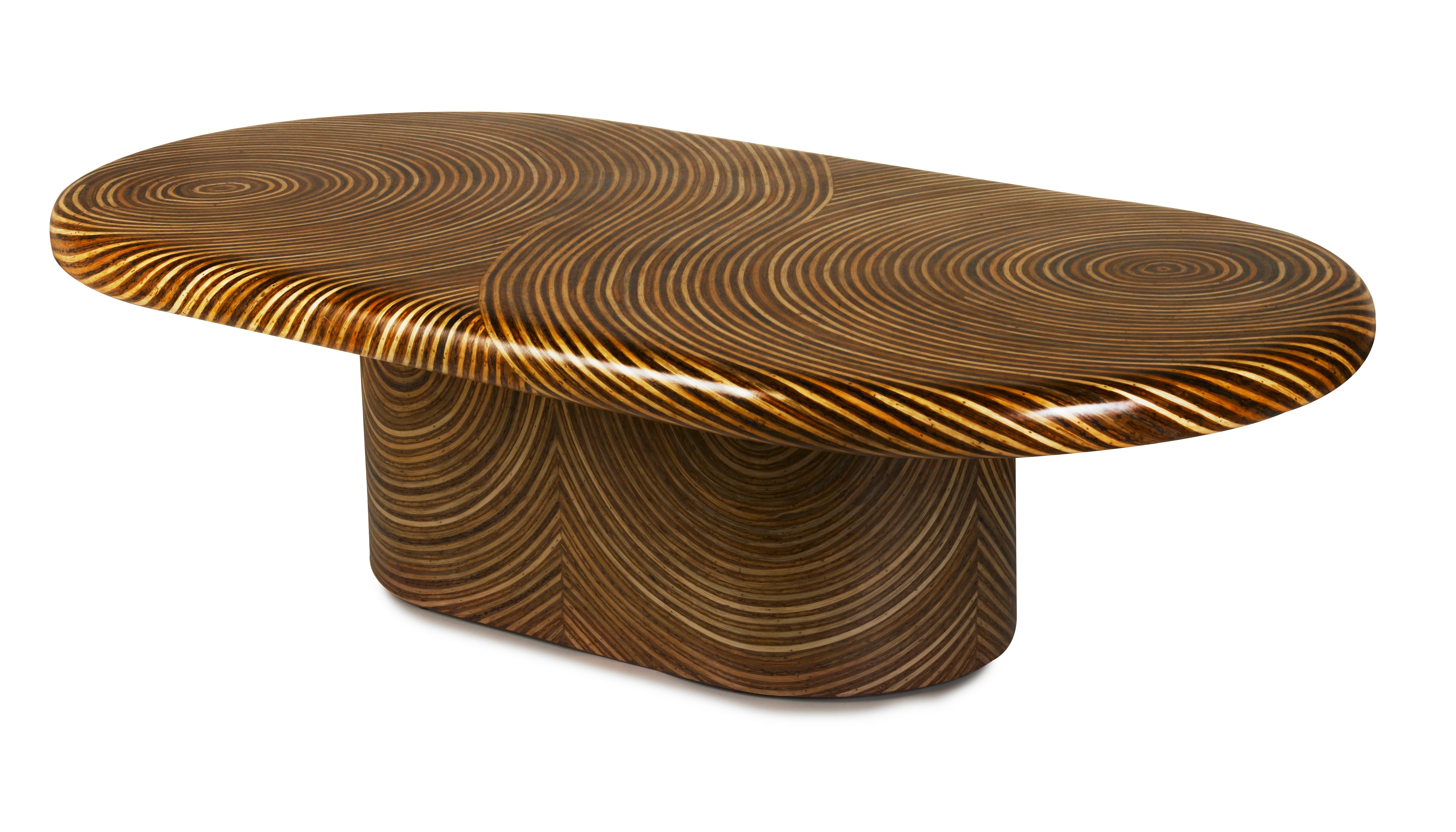 Swirling patterns are crafted through the artful inlay of rattan ribbons. The captivating 