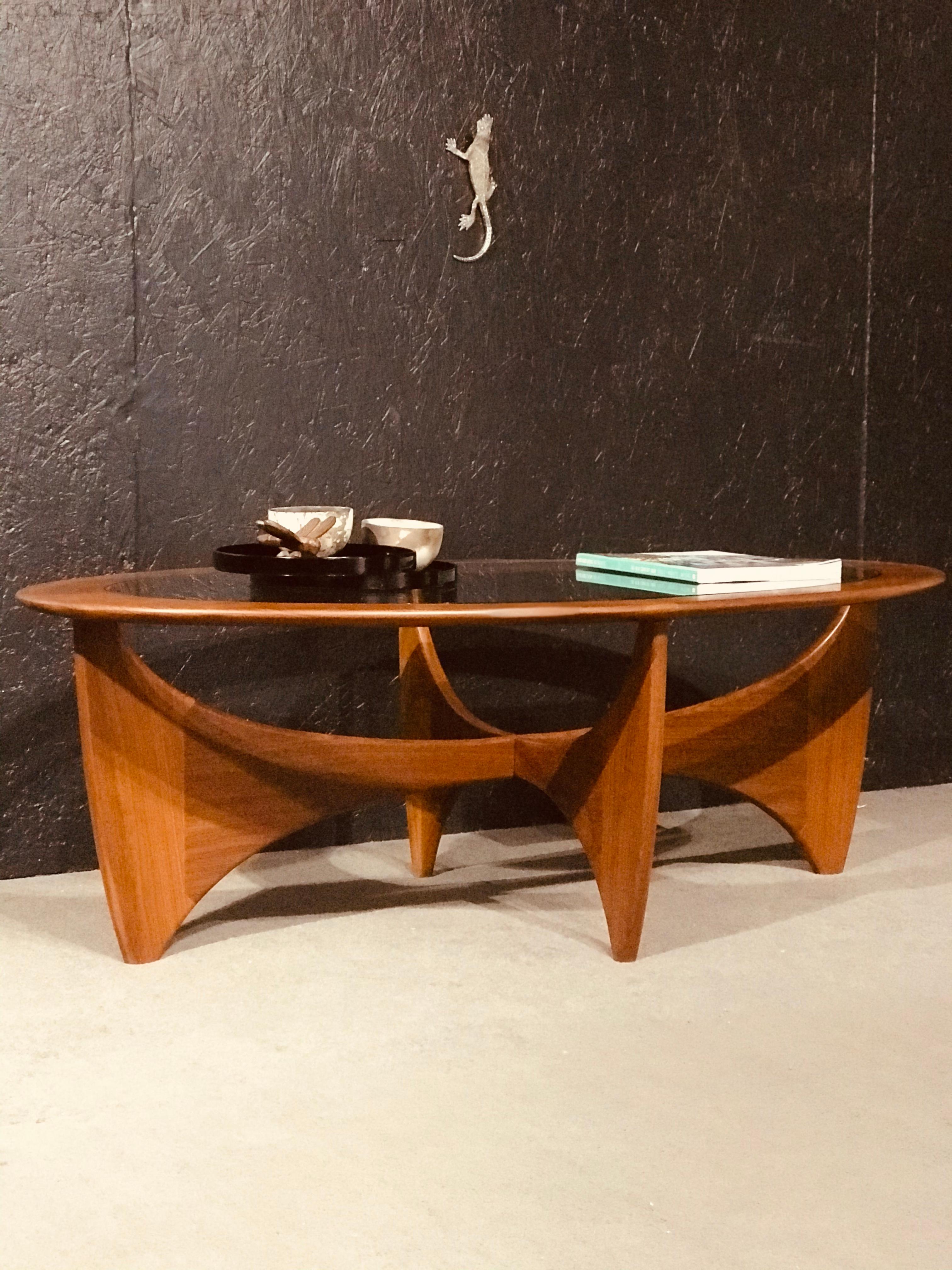 Oval side table designed by Viktor Wilkins for the renowned British brand G-Plan for the Astro collection.

Manufactured in vibrant teak wood with a glass top (the piece still has its original glass).

Dimensions

L: 123cm

W: 66cm

H: 43cm