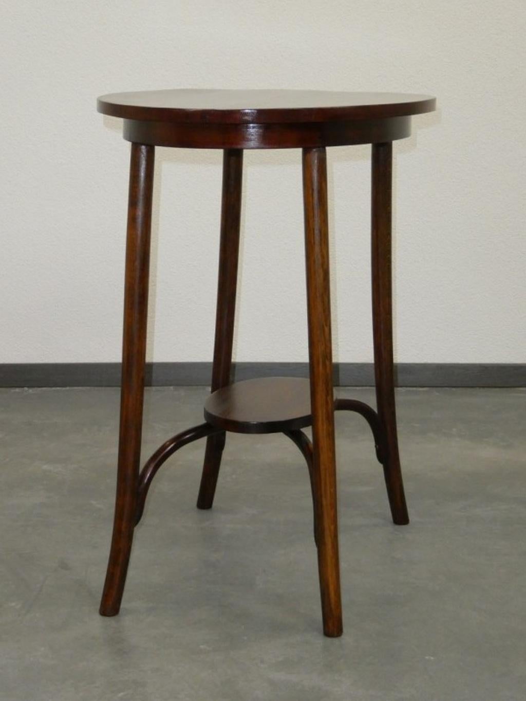 Oval side table by Thonet professionally stained and repolished.