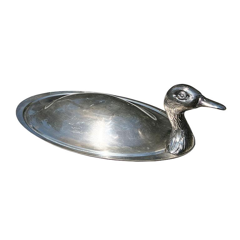 A large vintage Teghini Firenze silver plate duck serving platter. This piece may have originally come with a very shallow underplate. However, as we've seen, other pieces like this have been used to display crudités or fruit. It could also be used