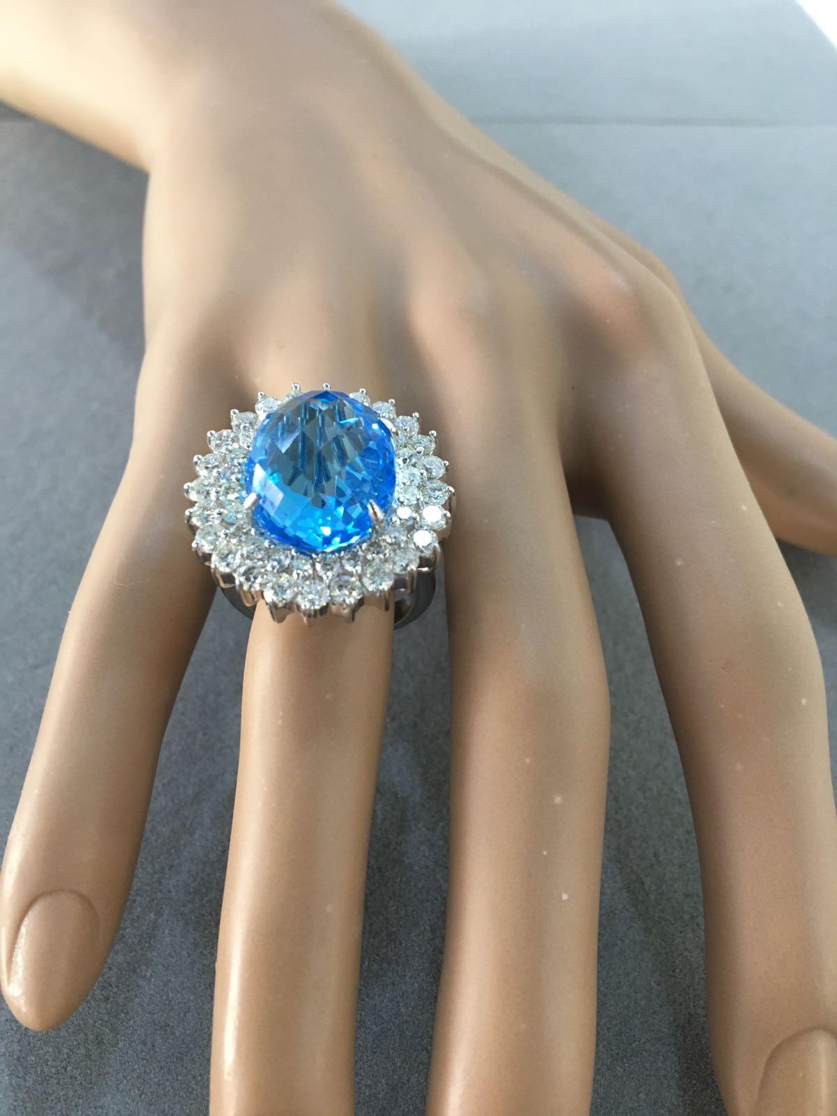Modern Oval Sky Blue Topaz Diamond Double Sun Ray Flower Halo 18 Karat White Gold Ring For Sale