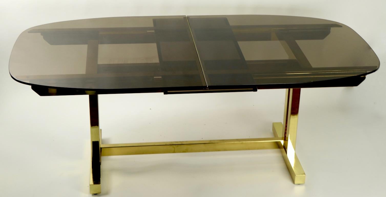 20th Century Oval Smoked Glass and Brass Dining Table For Sale