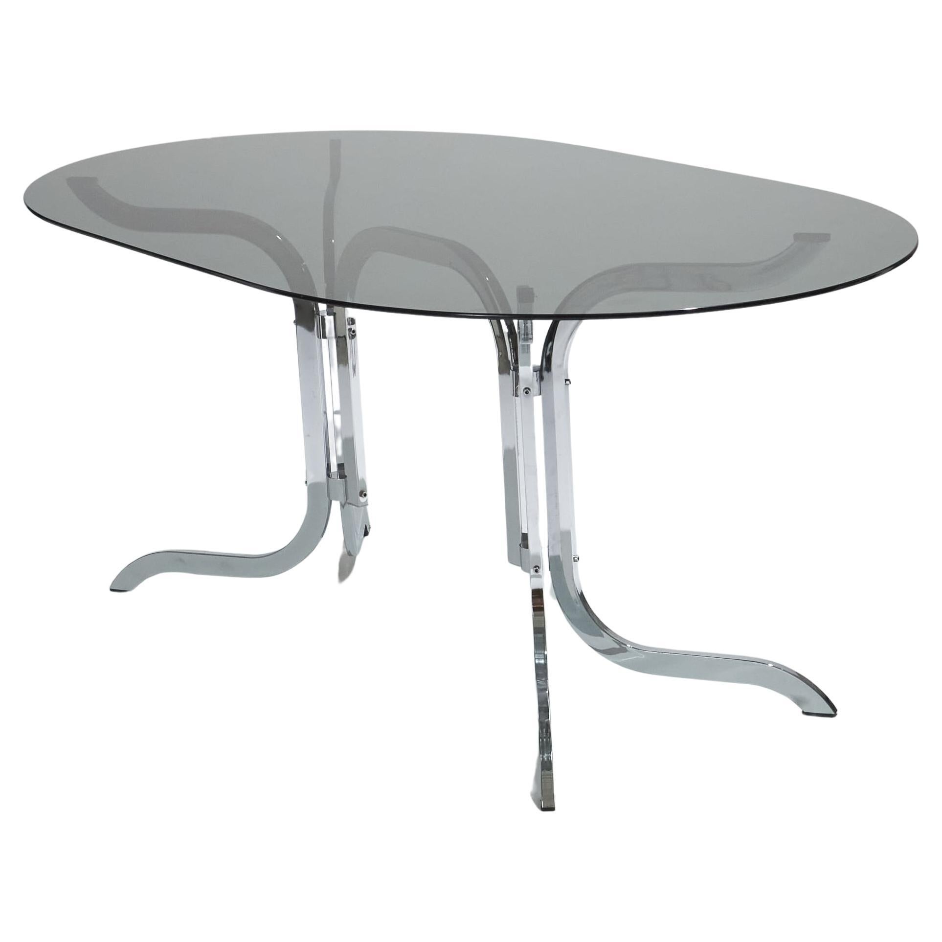 Mesa ovalada de cristal ahumado y cromo de Roche Bobois, años 70