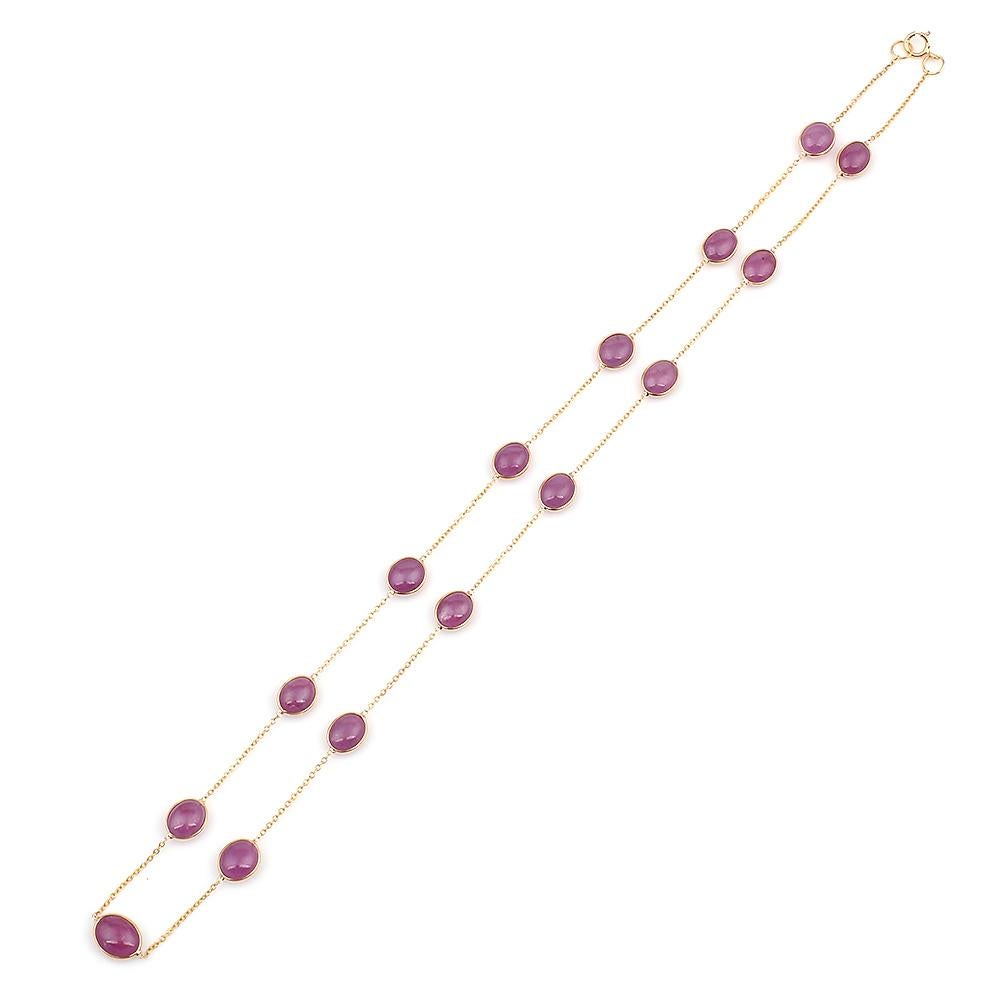 An Oval Smooth Ruby Bezel-Set Necklace made in 18 Karat Yellow Gold. The total weight of the necklace is 7.12 grams. 
The length of the necklace is 17.75