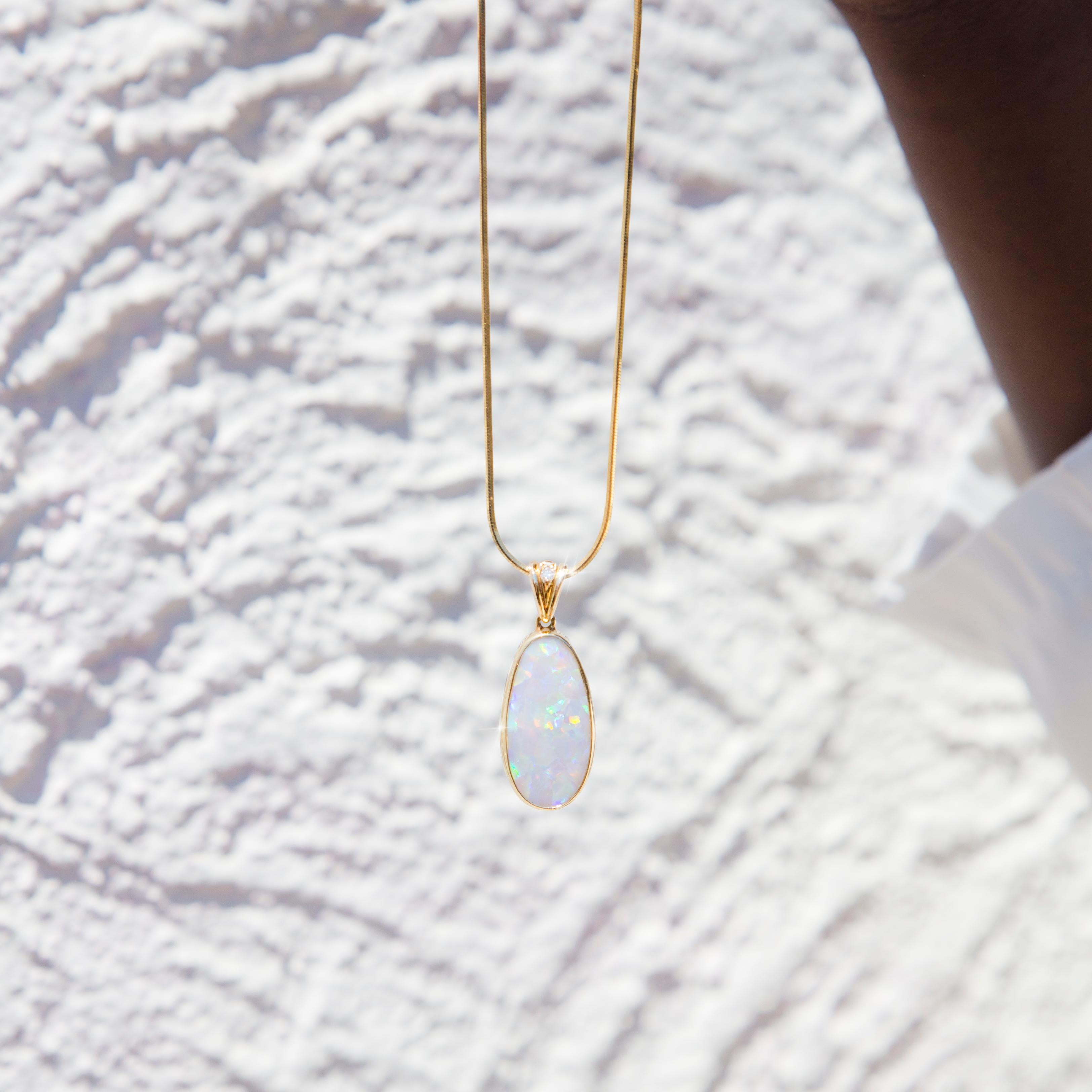 Artfully crafted in 18 carat yellow gold, this enchanting vintage pendant features an alluring solid freeform oval Australian opal carefully set in a minimalist bezel setting. We have named this gorgeous piece The Fleur Pendant. The Fleur Pendant