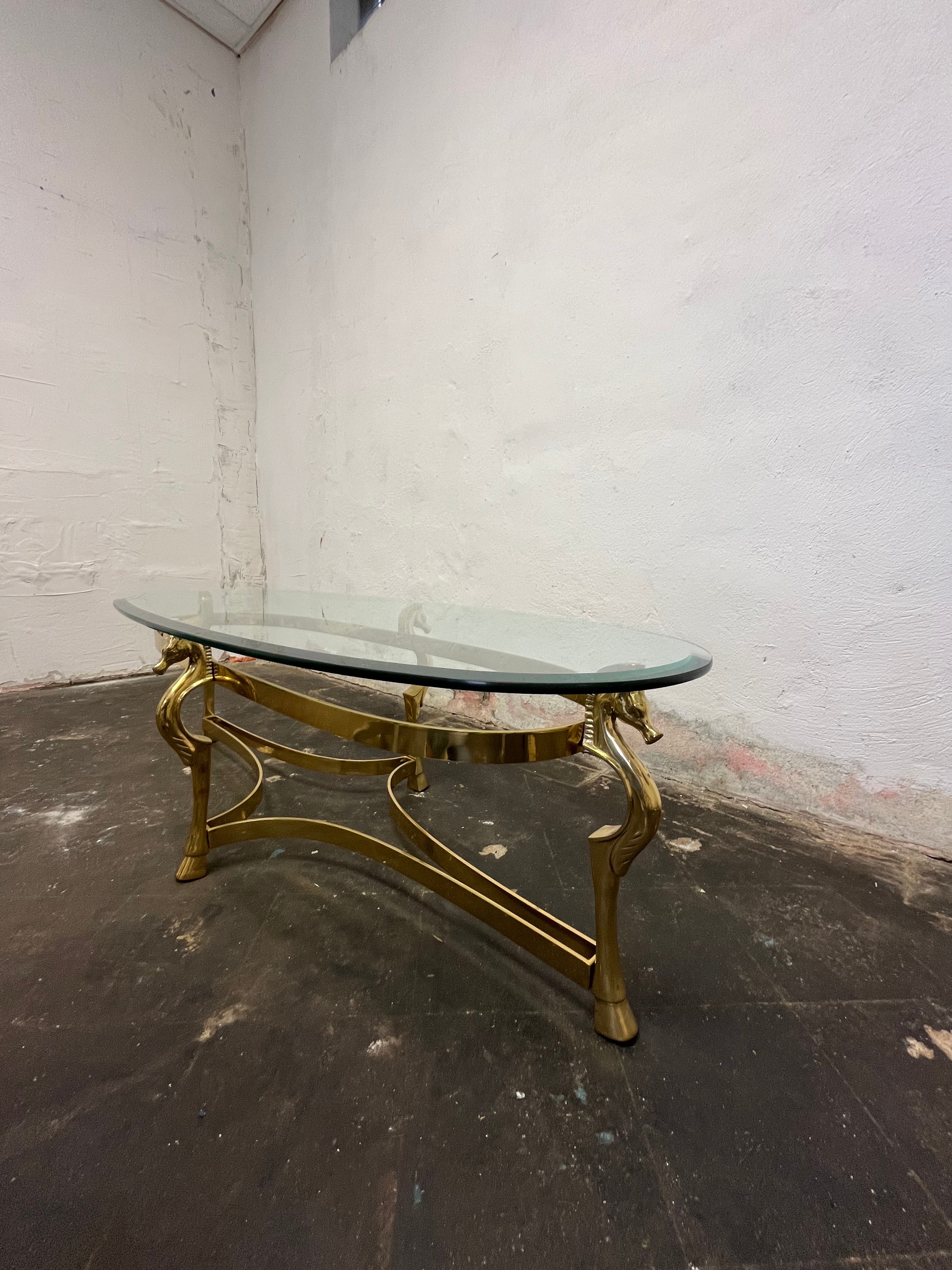 Mid Century Italian modern oval thick glass top brass base coffee table. Beautiful Horse motif with substantial presence. 
Curbside to NYC/Philly $450