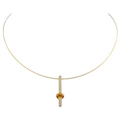 Collana con ciondolo a barretta con granato ovale e diamante in oro giallo 14 carati