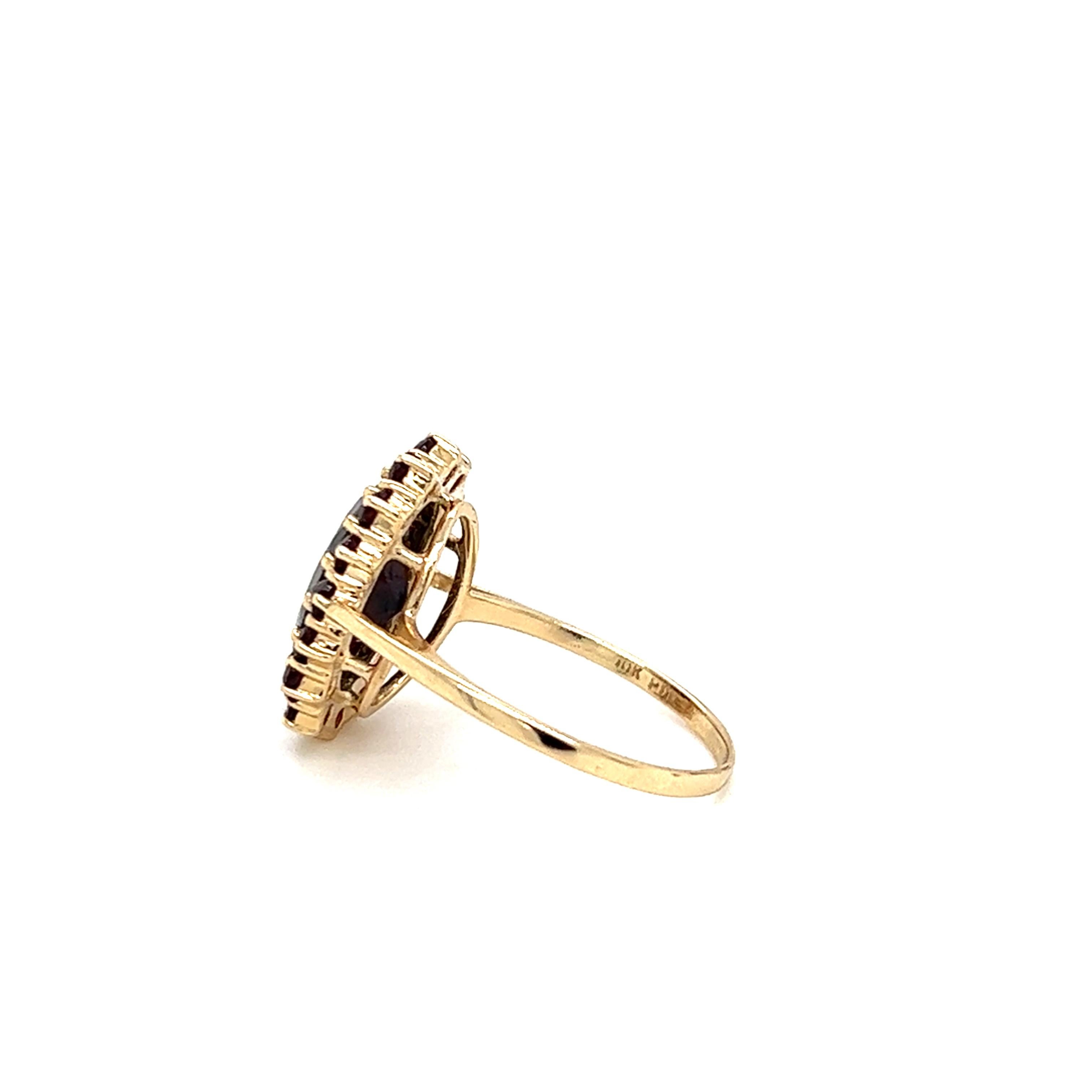 Contemporary Oval Spessartite Garnet Halo Ring in 10K Gold