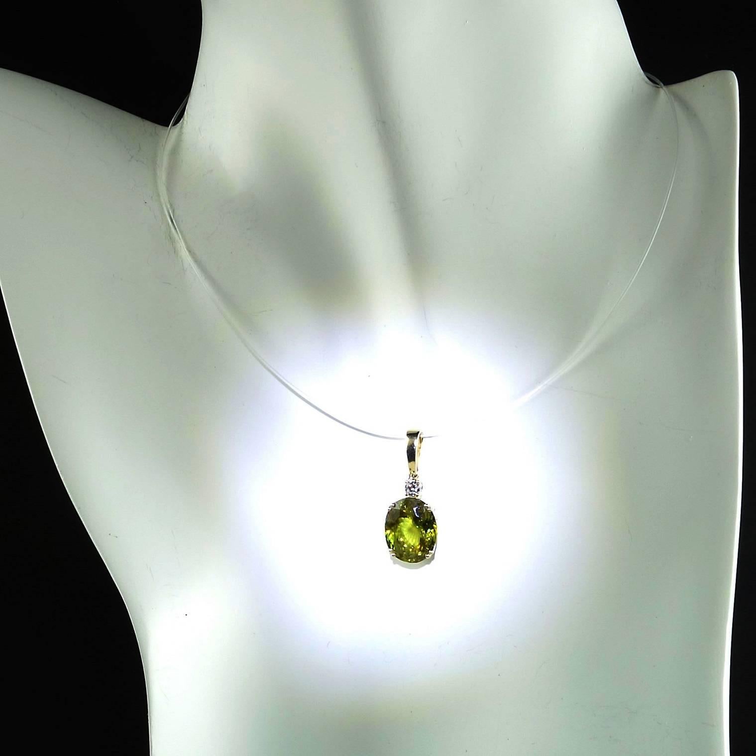 Custom made sparkling, brilliant oval Sphene Pendant with a diamond accent. This lovely green sphene is MORE BRILLIANT than diamond and will flash and sparkle as you move. The Sphene is 4.84 carats and it is accented with a 0.10 carat diamond. This