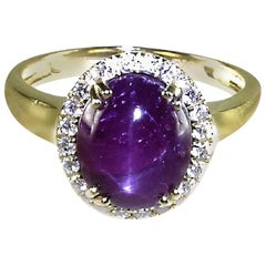 Oval Star Ruby Cabochon with Diamond Halo 14K Yellow Gold Ring