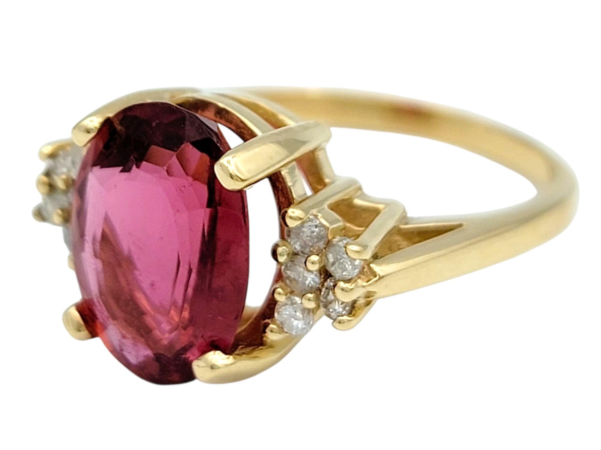 Oval Cut Oval Step Cut Pink Tourmaline and Cluster Diamond Ring in 14 Karat Yellow Gold For Sale