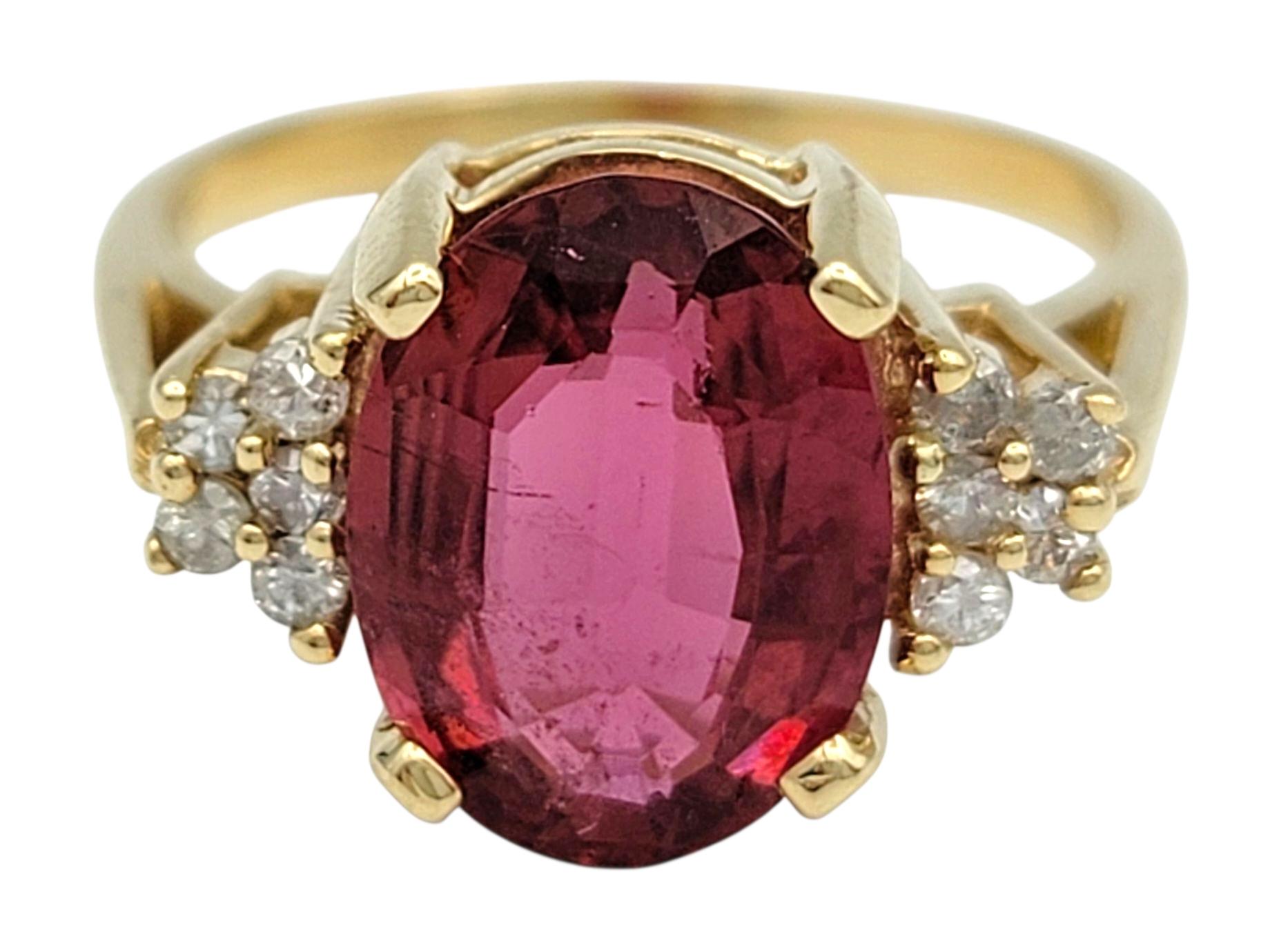 Oval Step Cut Pink Tourmaline and Cluster Diamond Ring in 14 Karat Yellow Gold In Good Condition For Sale In Scottsdale, AZ