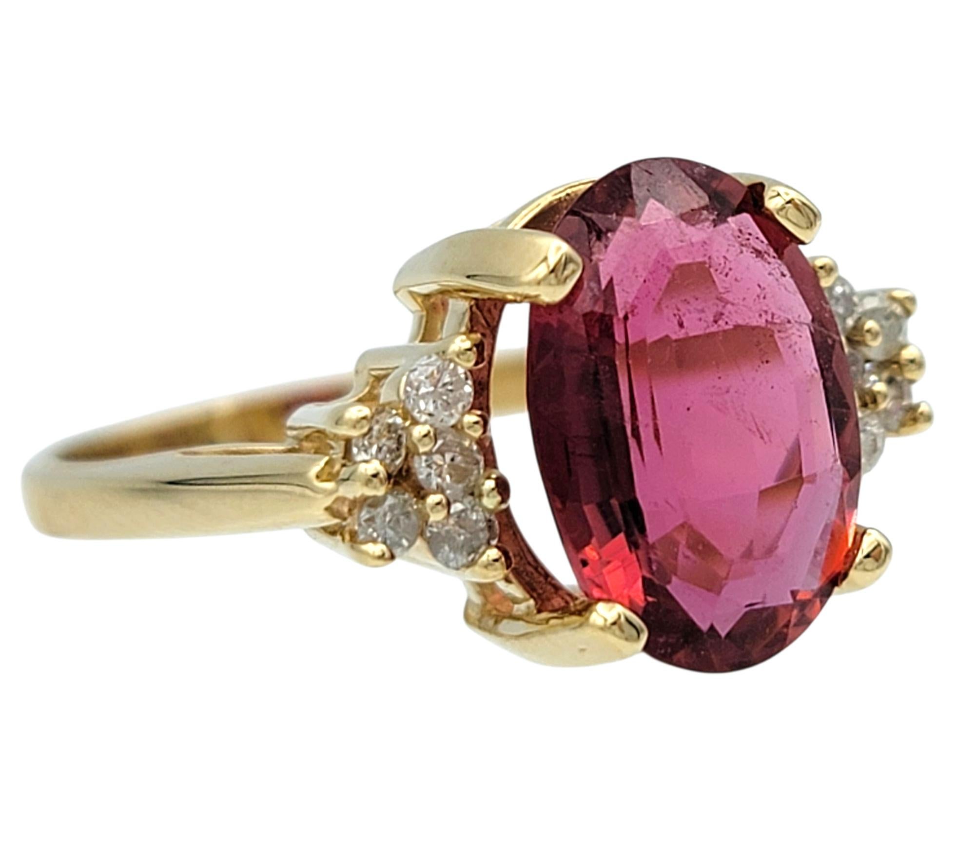 Women's Oval Step Cut Pink Tourmaline and Cluster Diamond Ring in 14 Karat Yellow Gold For Sale