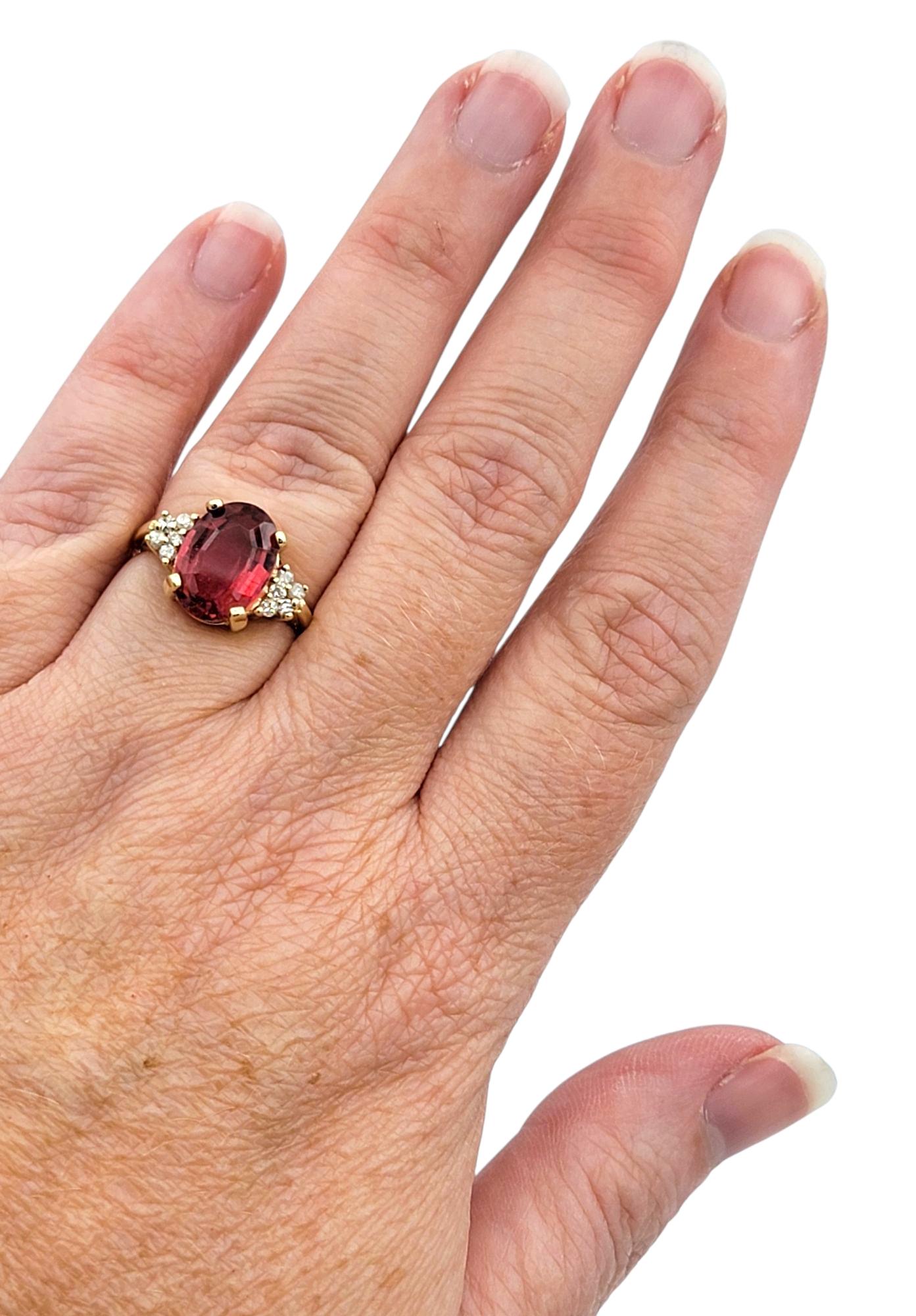 Oval Step Cut Pink Tourmaline and Cluster Diamond Ring in 14 Karat Yellow Gold For Sale 3
