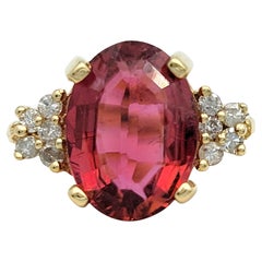 Oval Step Cut Pink Tourmaline and Cluster Diamond Ring in 14 Karat Yellow Gold