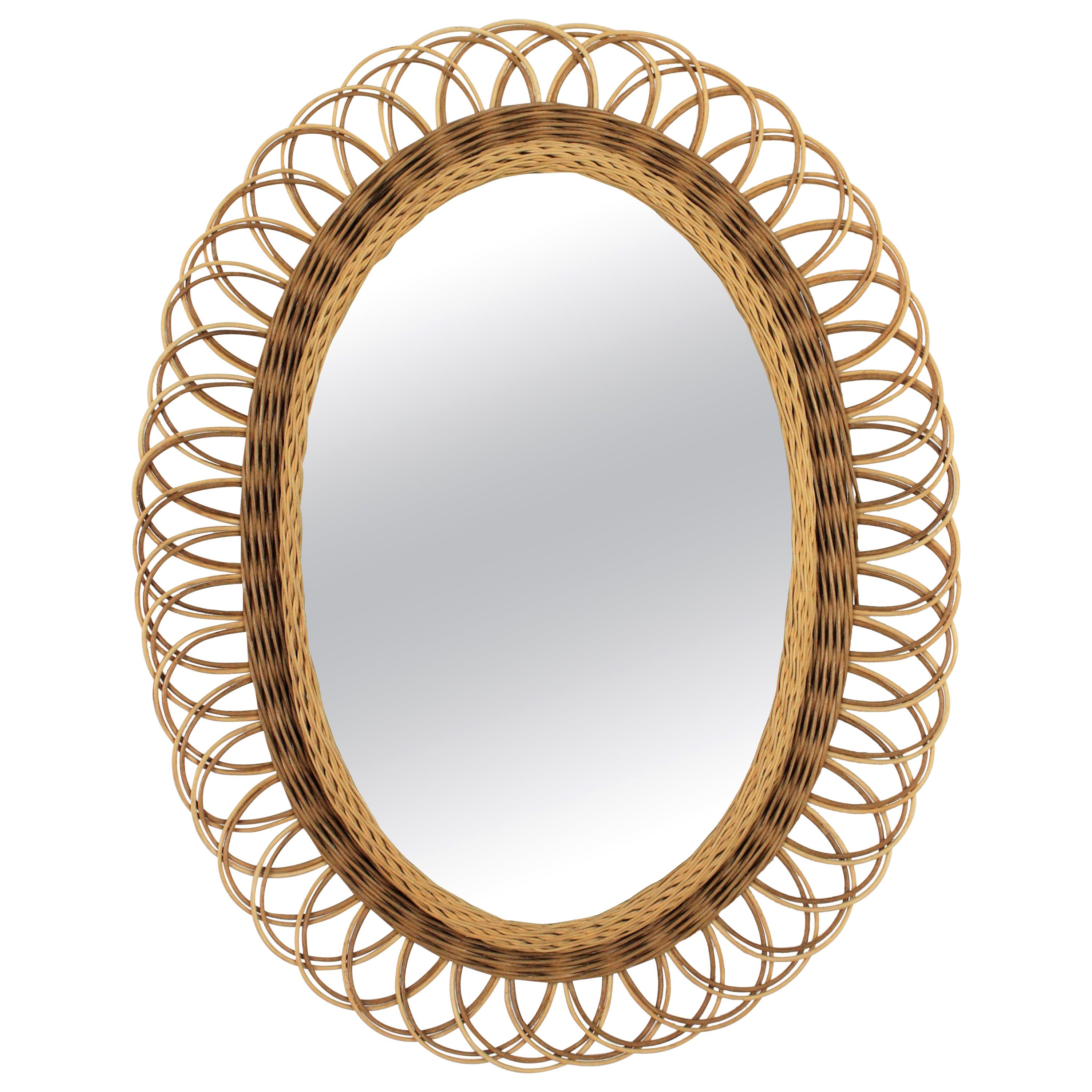 Mediterranean two-tone wicker rattan sunburst flower oval mirror, Spain, 1960s
This lovely oval mirror was handcrafted at the Mid-Century Modern Period and it has a beautiful two- tone wicker frame that makes it highly decorative.
Interesting to