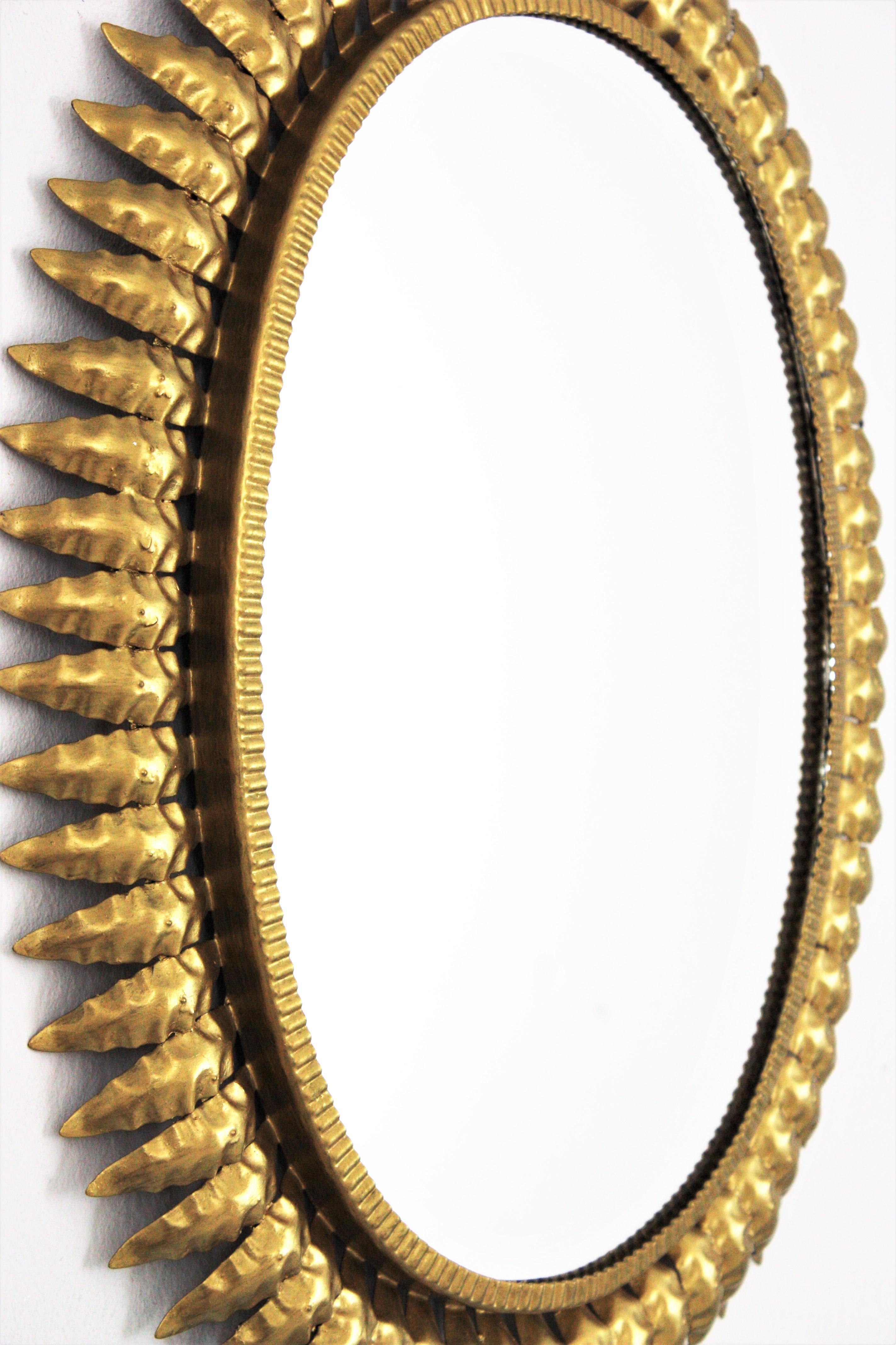 Mid-Century Modern 1960s Spanish Sunburst Oval Mirror, Gilt Iron For Sale