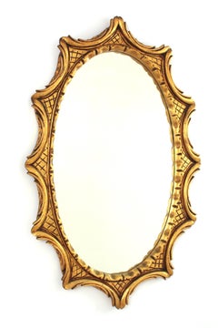 Specchio ovale a raggiera in legno dorato intagliato, Spagna, anni '50