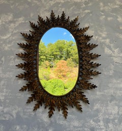 Oval Sunburst Mirror with Alternating Leaves