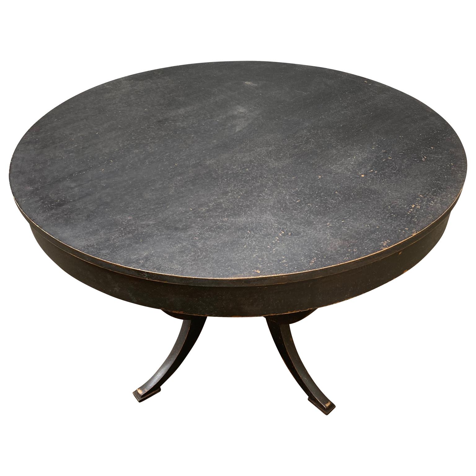 A Swedish black painted Biedermeier style oval table from circa 1920s-1930s.