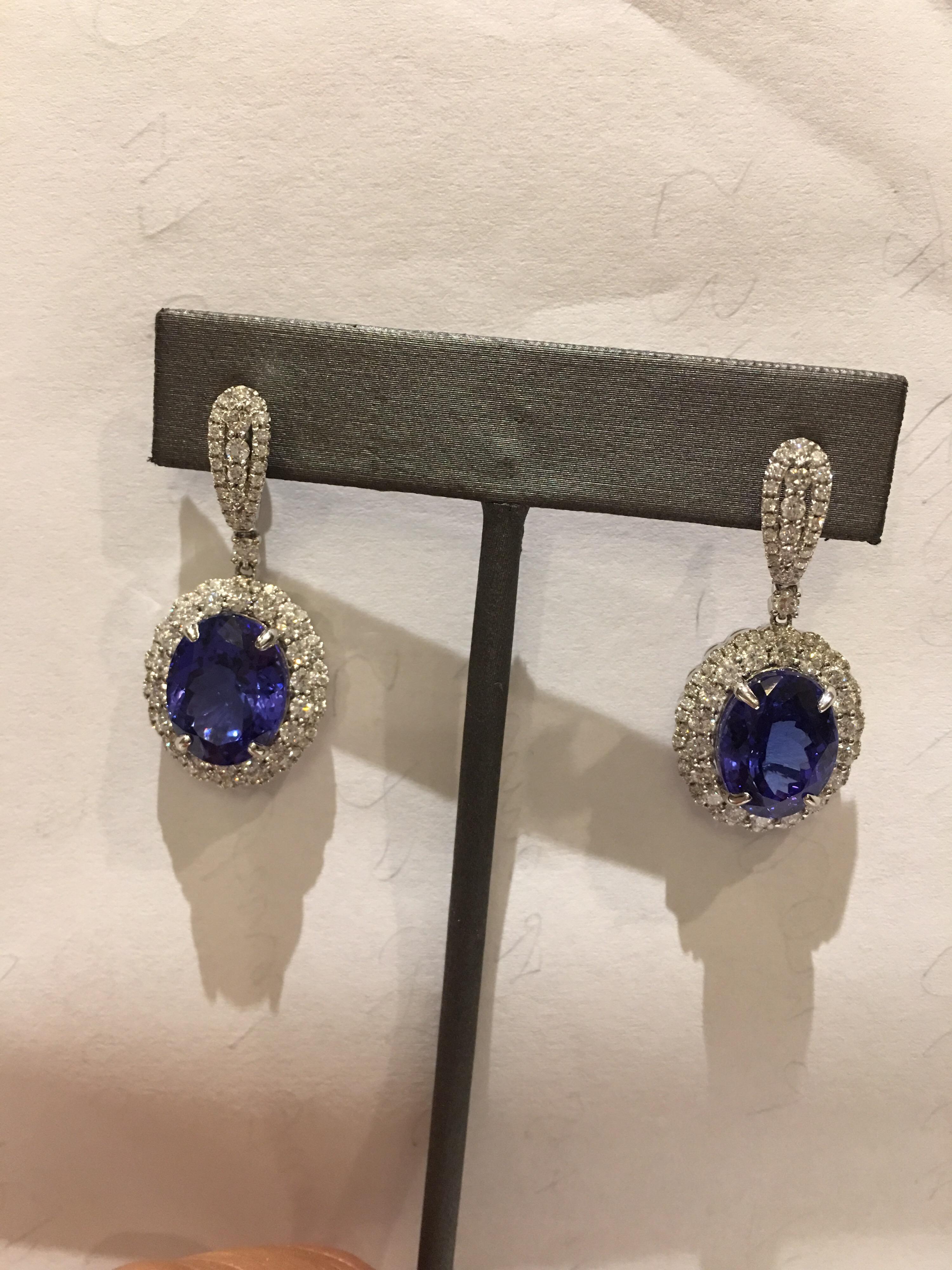 Natural AAA Quality and Royal Ink Blue Tanzanite set in 14 Karat white Gold .
Total weight of Tanzanite is 14.00 Carat and White round diamonds is 2.73 Carat.