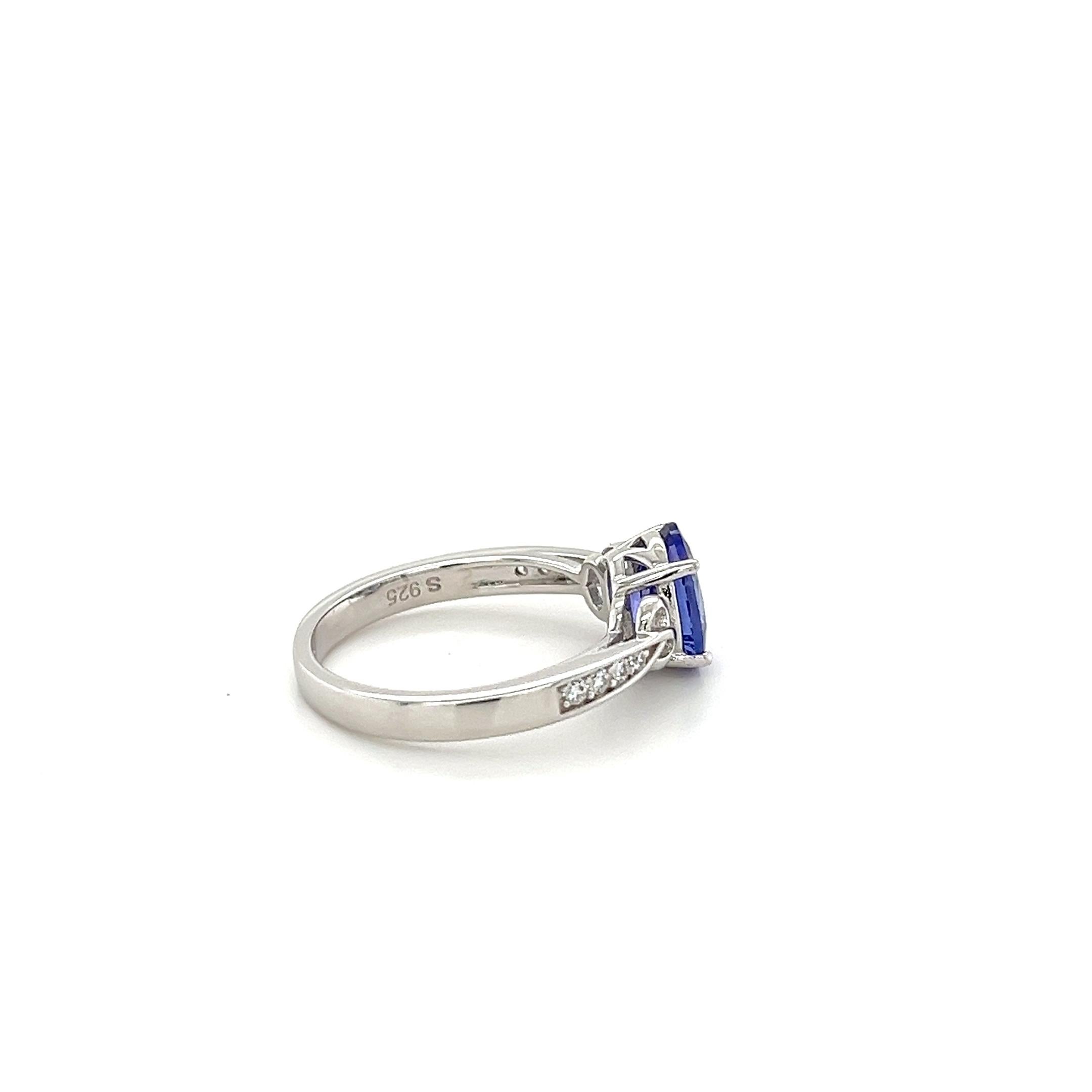 Oval Cut Oval Tanzanite and Cubic Zirconia Accent Ring in White Gold Cocktail Ring For Sale