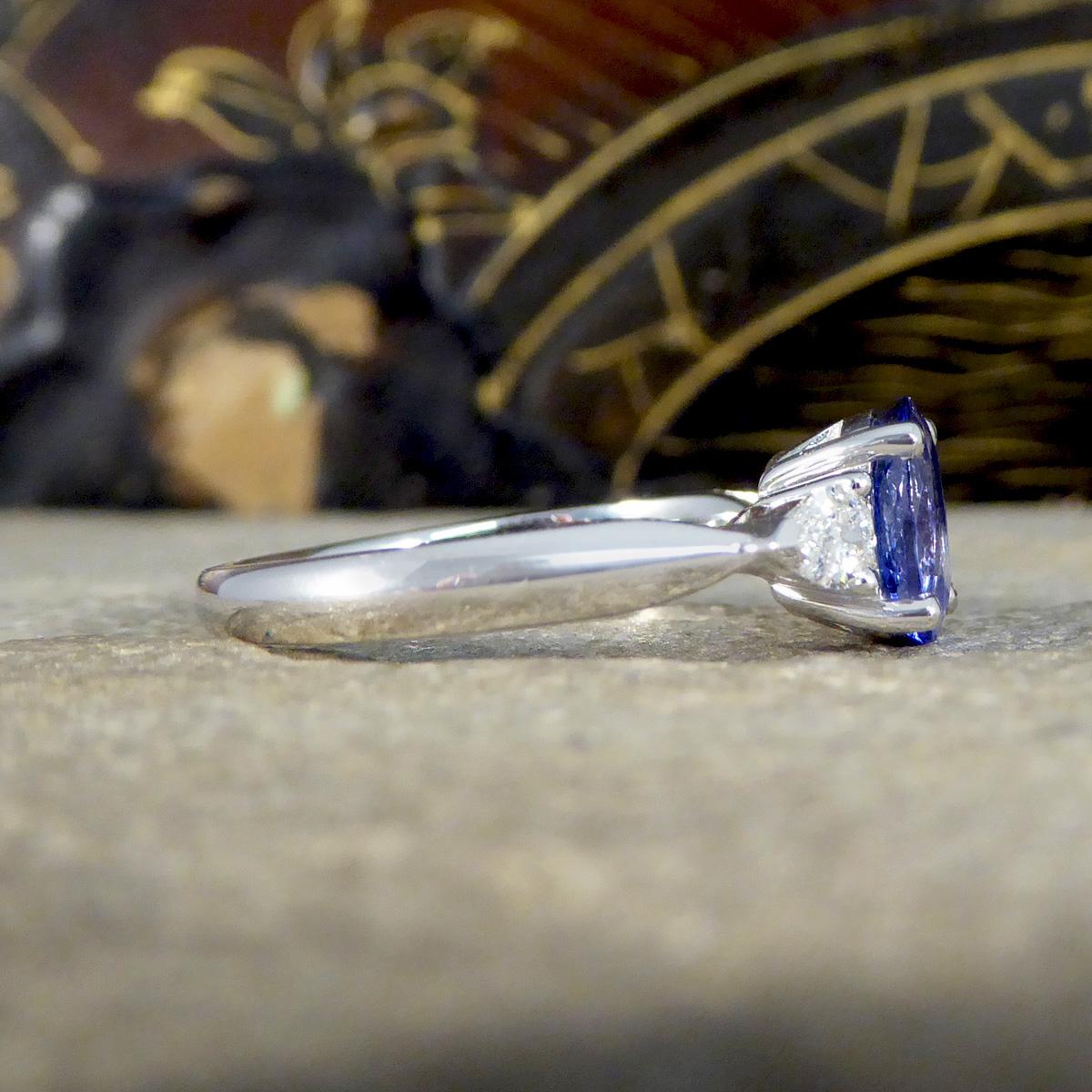 Modern Oval Tanzanite and Pear Cut Diamond Three Stone Ring in Platinum For Sale