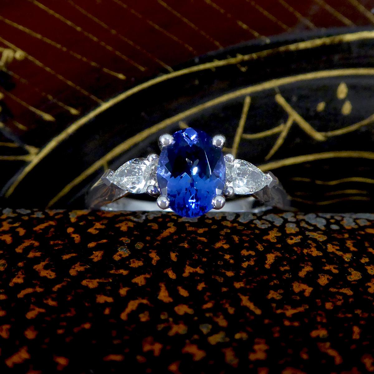Oval Tanzanite and Pear Cut Diamond Three Stone Ring in Platinum For Sale 2