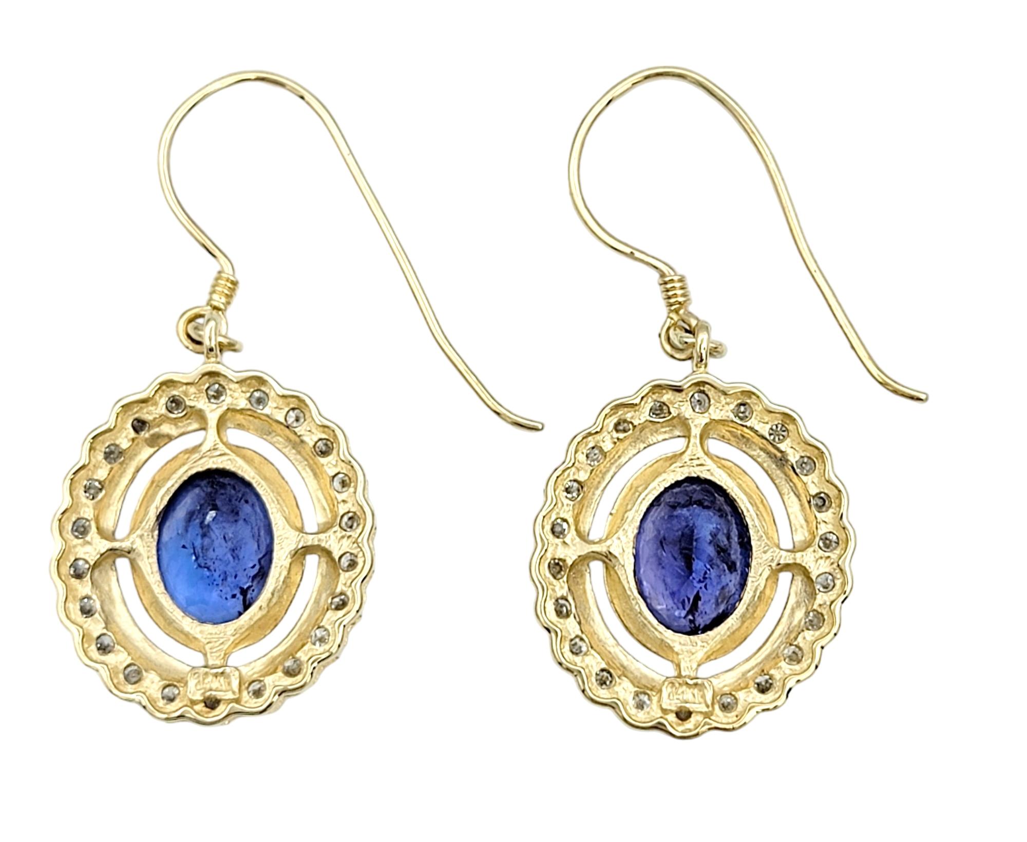Oval Tanzanite and Round Diamond Halo Dangle Earrings in 14 Karat Yellow Gold In Good Condition For Sale In Scottsdale, AZ