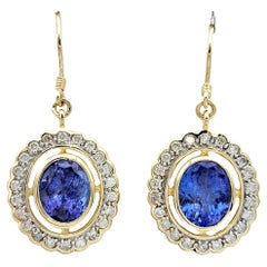 Pendants d'oreilles en or jaune 14 carats avec tanzanite ovale et halo de diamants ronds