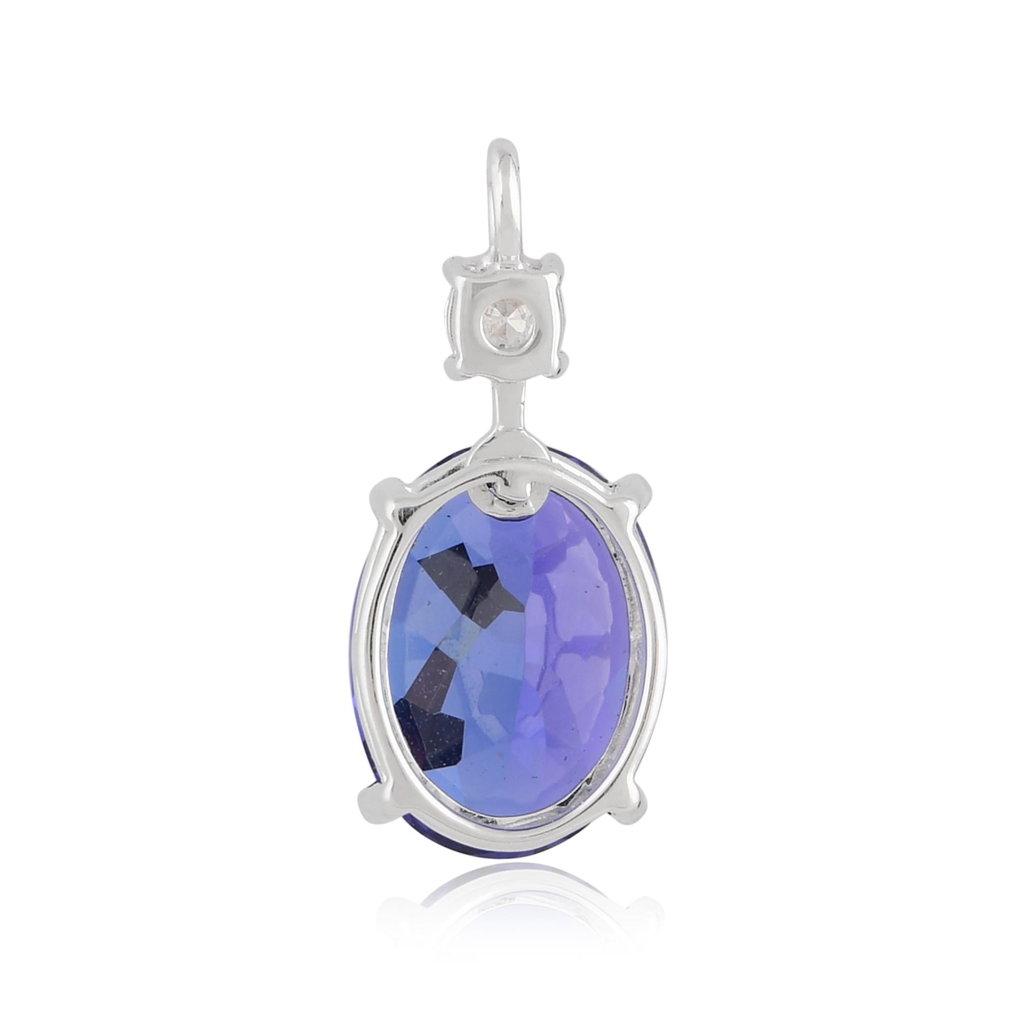 Crafted in 18 karat white gold, the pendant's setting enhances the beauty of the Tanzanite and diamonds. White gold's timeless appeal and lustrous finish create a perfect backdrop, showcasing the gemstones' brilliance and adding a touch of refined
