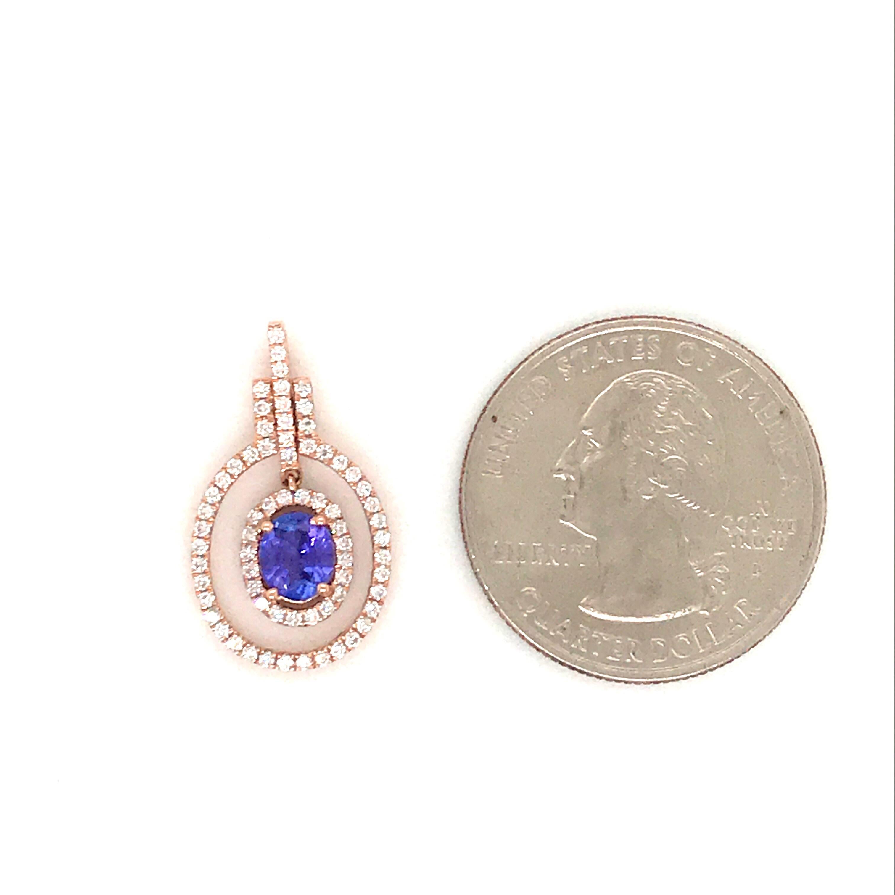 14K Rose gold pendant featuring one oval cut tanzanite, 0.62 carats, flanked with round brilliance weighing 0.28 carats. Comes with a 14k rose gold chain.
Color G
Clarity SI